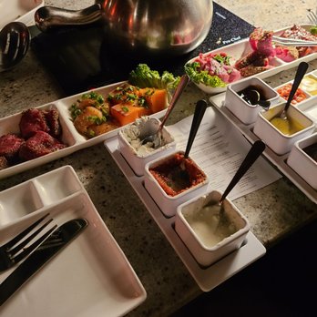 The Melting Pot - a variety of food items on a table - Fondue Near Me - Reston, Virginia The Melting Pot - a variety of food items on a table - Fondue Near Me - Reston, Virginia