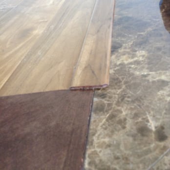 Incredible Flooring - The cut edge of the molding is unsealed and is too sharp to kids' little toes - Carpeting Near Me - Orange, California