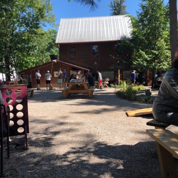 Cherry Republic - Back picnic area with tables and Adirondack chairs. - Specialty Food Near Me - Glen Arbor, Michigan
