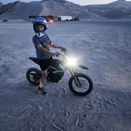 Little guy happy as a clam getting ready to ride for his first time. Little guy happy as a clam getting ready to ride for his first time.