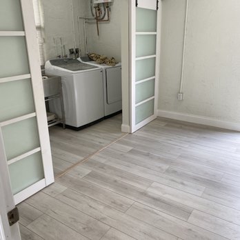Nealy Remodeling & Residential Construction - a laundry room with a washer and dryer - General Contractors Near Me Nealy Remodeling & Residential Construction - a laundry room with a washer and dryer - General Contractors Near Me