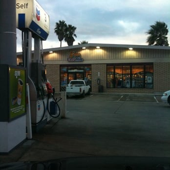 Chevron - a gas station with cars parked in front of it - Gas Stations Near Me - Ventura, California