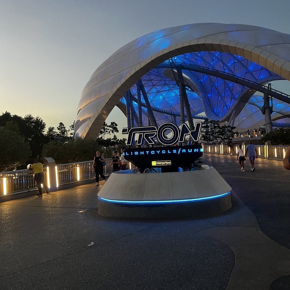 Tron Lightcycle Run - In front of TRON in the evening. - Amusement Parks Near Me - Orlando, Florida Tron Lightcycle Run - In front of TRON in the evening. - Amusement Parks Near Me - Orlando, Florida