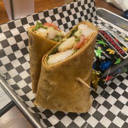 a sandwich on a checkered tray a sandwich on a checkered tray