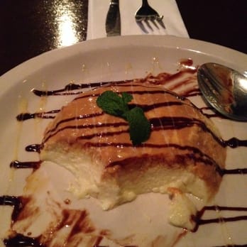 Cinco - My half eaten caramel flan - a traditional Mexican dessert! - Mexican Near Me - Los Angeles, California Cinco - My half eaten caramel flan - a traditional Mexican dessert! - Mexican Near Me - Los Angeles, California