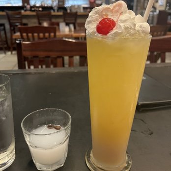 Opa! Greek Taverna - A shot of Ouzo and "Sex in the Greek" cocktail was huge.  The bar is shown in the background. - Greek Near Me - Rowlett, Texas