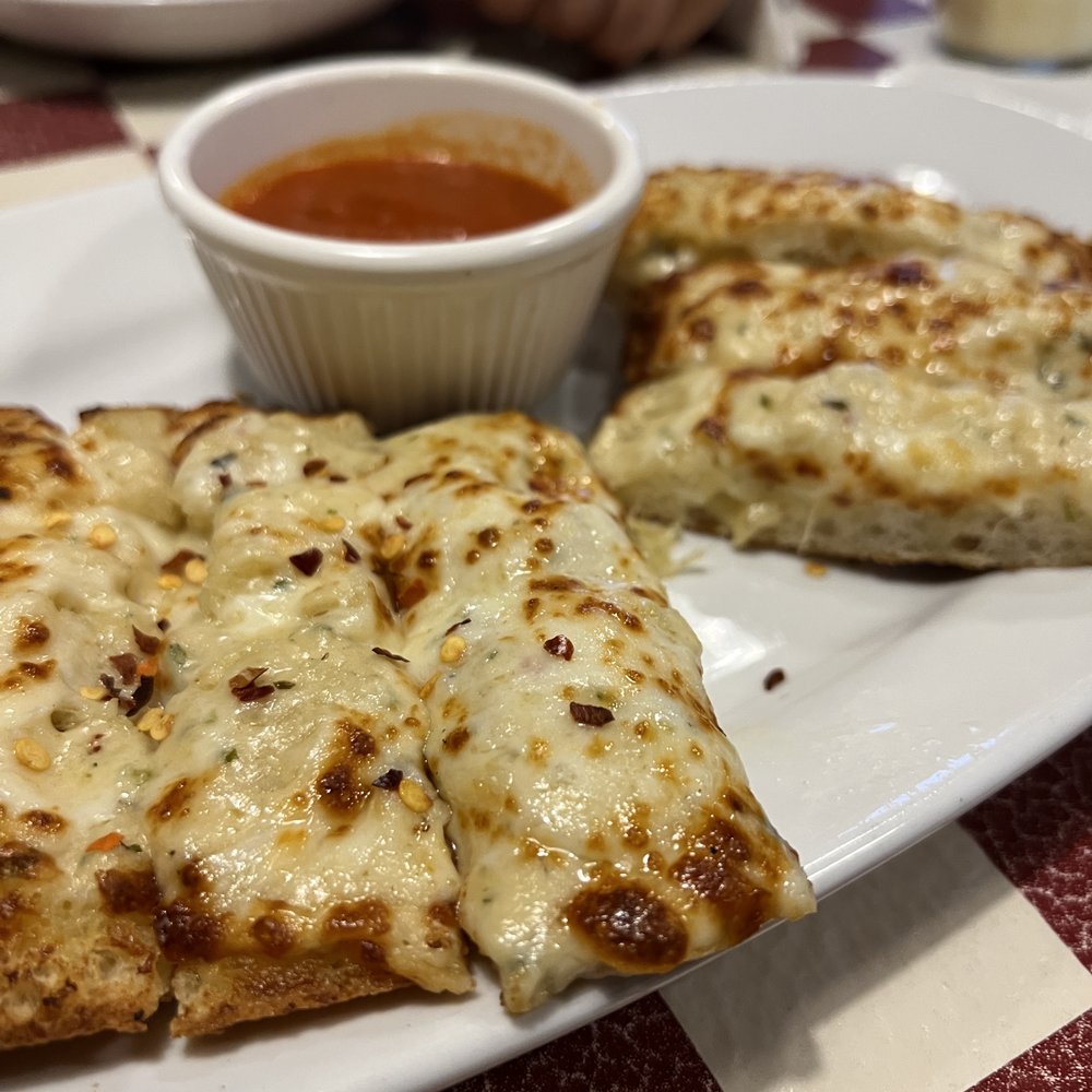 Giordano's - a plate of pizza and dipping sauce - Pizza Near Me - St. Charles, Illinois