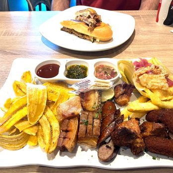 Cubanidad - Yuca, chicharritas, chicharrón, sausage, croquetas Spicy Chimichurri, y tamal all for $16.95 - Cuban Near Me - Henderson, Nevada