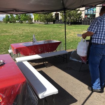 Tarricaso - a man standing under a tent - Food Trucks Near Me