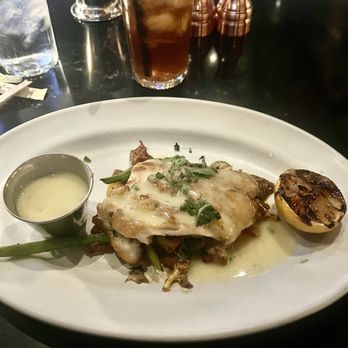 The Arrogant Butcher - PACIFIC SEA BASS Grilled Artichoke, Green Bean, Slow Roasted Tomato, Green Olive, Lemon Caper Butter - American Near Me - Phoenix, Arizona