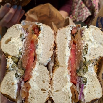 Murray's Bagels - Gravlax on an everything bagel with onion, tomato, capers - Bagels Near Me - New York, New York Murray's Bagels - Gravlax on an everything bagel with onion, tomato, capers - Bagels Near Me - New York, New York