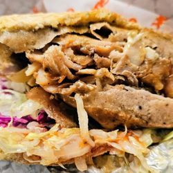German Doner Kebab - Doner Kebab - chicken and beef shwarma, German slaw, tomato, lettuce, and garlic, yogurt, and spicy sauces.