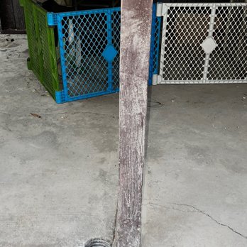 Monazi Construction - a wooden pole with a hole in it - General Contractors Near Me
