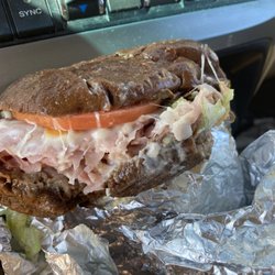 Billy's Time Out Deli - An ooey gooey tasty Ham and cheese on pumpernickel, loaded with a pickle and pepper on the side