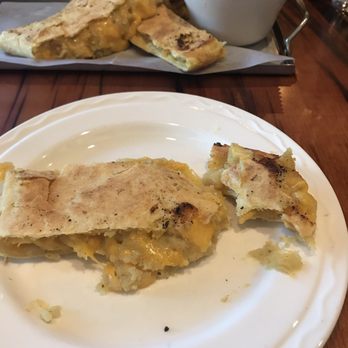 Callaloo - Roti shareable. Has potato cheese and is spicy with a nice sour cream sauce. - Caribbean Near Me - Lancaster, Pennsylvania