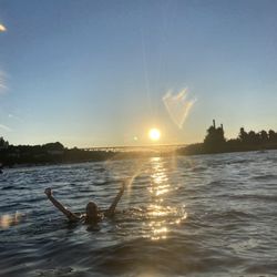 Hopping out & swimming around in Lake Union with Gas Works & sunset in the background