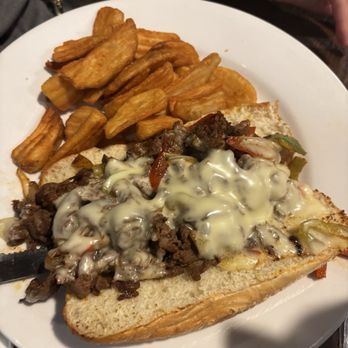 Captain Jack's Island Grill - Philly cheesesteak sandwich with fries. The dish was good but not the best they had on the menu. - American Near Me - Lahaina, Hawaii