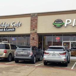 cars parked in front of the restaurant