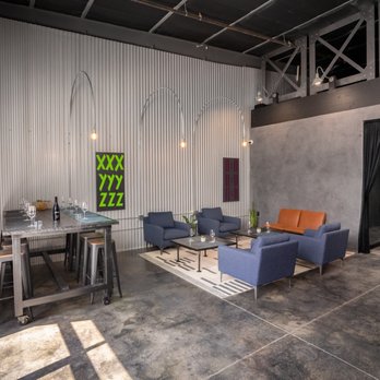 CRUSH Vineyard - a living room with a dining table and chairs - Wine Tasting Room Near Me - Paso Robles, California CRUSH Vineyard - a living room with a dining table and chairs - Wine Tasting Room Near Me - Paso Robles, California