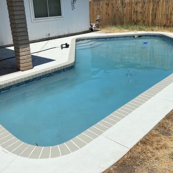 Lions Head Pool Specialist - After (New Pebble Finish and Tile along with new filtration system and pump) - Pool & Hot Tub Service Near Me - Peoria, Arizona