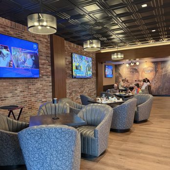 Amici Pizzeria & Bar - Club chair seats in the dining room - Pizza Near Me - Reno, Nevada Amici Pizzeria & Bar - Club chair seats in the dining room - Pizza Near Me - Reno, Nevada