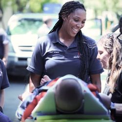 American Health Education - EMT students learning to load an ambulance