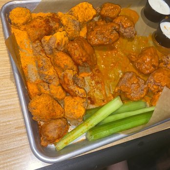 Buffalo Wild Wings - My friends wings after he applied the sauce and dry rub - American Near Me - Champlin, Minnesota