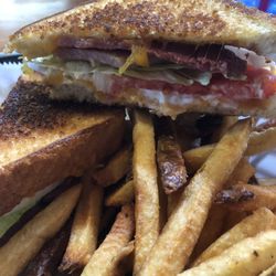 Justin's Place - Jim's Country Ham Sandwich with hand cut fries.
