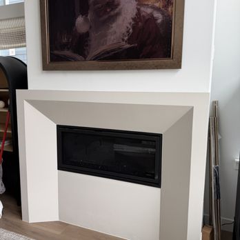 Surge Construction Services - Custom fireplace build-out with modern design and clean finish as part of a home remodel. - Handyman Near Me - Lehi, Utah Surge Construction Services - Custom fireplace build-out with modern design and clean finish as part of a home remodel. - Handyman Near Me - Lehi, Utah