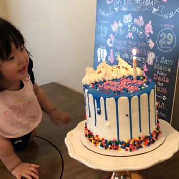 Paige's Bakehouse - The birthday girl admiring the delicious Strawberry mousse cake. - Bakeries Near Me - Round Rock, Texas Paige's Bakehouse - The birthday girl admiring the delicious Strawberry mousse cake. - Bakeries Near Me - Round Rock, Texas