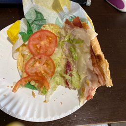 a paper plate with a sandwich on it a paper plate with a sandwich on it