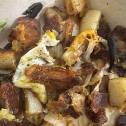 Dry Potatoes, over cooked bacon, onions,