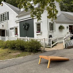 Jack's Outback Restaurant - The outside, play corn hole while you wait. (It's worth the wait!)