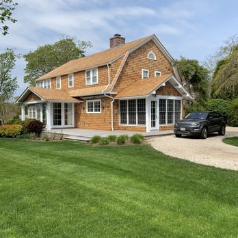 M Stevens Roofing & Remodeling Co. | Hamptons Roofing Company - a house with a brown shingled roof and - Roofing Near Me - Southampton, New York M Stevens Roofing & Remodeling Co. | Hamptons Roofing Company - a house with a brown shingled roof and - Roofing Near Me - Southampton, New York