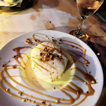 Semilla - The Floating Island Egg white Meringue , Vanilla Cream , Dulce de Leche sauce , toasted nuts - French Near Me - Miami Beach, Florida Semilla - The Floating Island Egg white Meringue , Vanilla Cream , Dulce de Leche sauce , toasted nuts - French Near Me - Miami Beach, Florida