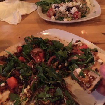 Off Broadway Drafthouse - Lamb flatbread and Aphrodite (chicken dish) - Pubs Near Me - Madison, Wisconsin Off Broadway Drafthouse - Lamb flatbread and Aphrodite (chicken dish) - Pubs Near Me - Madison, Wisconsin