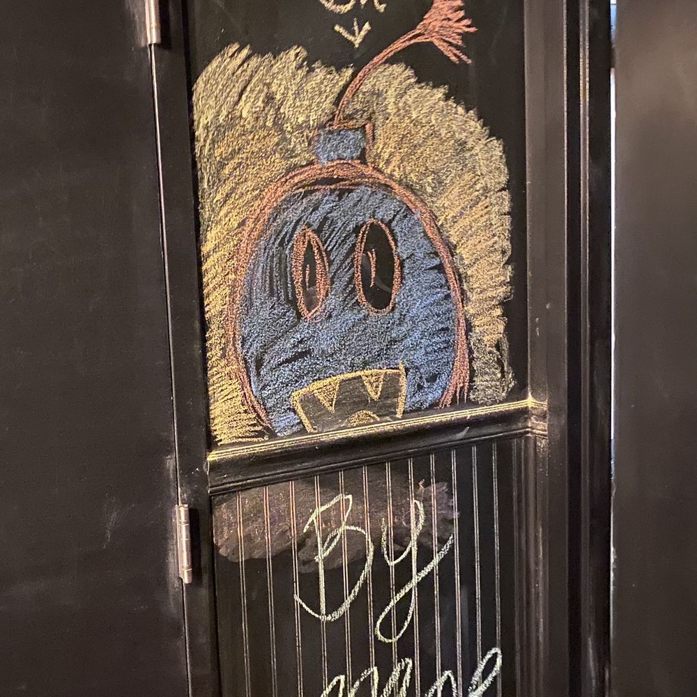 a chalk drawing on a door