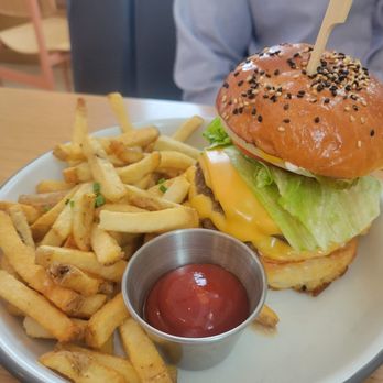 Wilfred's - Royale with Cheese Double Patty, American Cheese, Burger Sauce, Sliced Onions, House Pickles, Housemade Milk Bun. - Diners Near Me - Edmonton, Alberta