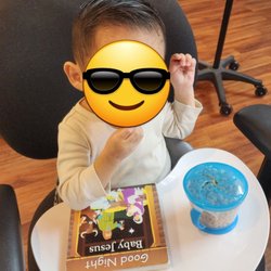 Hair By Ceasar - Snacking, reading, and watching CocoMelon on his UpSeat booster while it's my turn for a haircut!