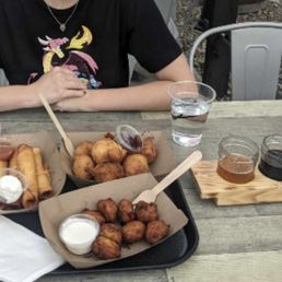 Assortment of tasty fried treats and a nice flight of beers & ciders.