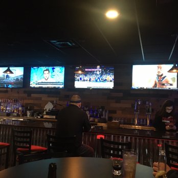 Rustic Pub - View of the bar. 8 TVs total with above the bar. - Sports Bars Near Me - Parma, Ohio
