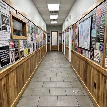 Fletchers Outdoors - a long hallway with posters on the walls - Guns & Ammo Near Me - Andalusia, Alabama Fletchers Outdoors - a long hallway with posters on the walls - Guns & Ammo Near Me - Andalusia, Alabama
