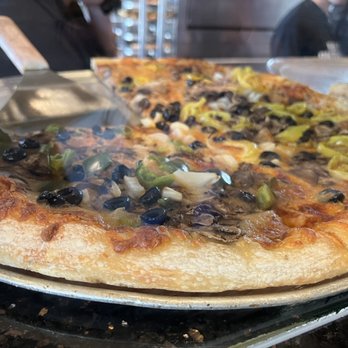 Salvatore's Old Fashioned Pizzeria - a close up of a pizza - Pizza Near Me - Honeoye Falls, New York Salvatore's Old Fashioned Pizzeria - a close up of a pizza - Pizza Near Me - Honeoye Falls, New York