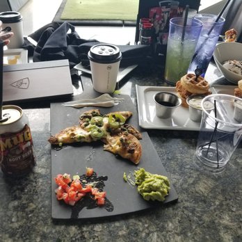 Topgolf - Steak nachos, buffalo chicken wings, chicken & waffles and a bowl of vanilla ice cream with chocolate syrup and nuts for the bday boy! - Golf Near Me - Ashburn, Virginia