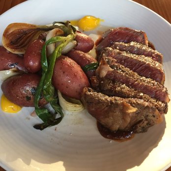 Terra Plata - Grass-fed ribeye... new potatoes, soft yolk, grilled spring onions, smokey glaze - New American Near Me - Seattle, Washington Terra Plata - Grass-fed ribeye... new potatoes, soft yolk, grilled spring onions, smokey glaze - New American Near Me - Seattle, Washington