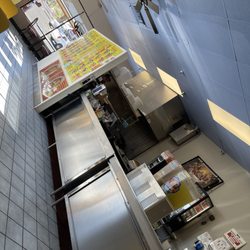 Rodolfo's Taco Shop - Menu wal in front of the counter.