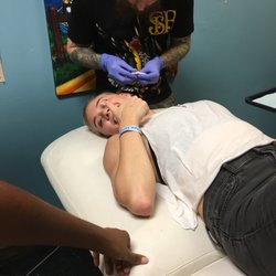 Flash City Tattoo - Smiddie gets her cartilage pierced