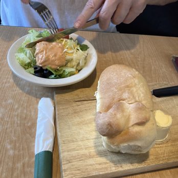 Wagon Wheel Lounge - a person cutting a sandwich on a cutting board - Lounges Near Me - Lava Hot Springs, Idaho Wagon Wheel Lounge - a person cutting a sandwich on a cutting board - Lounges Near Me - Lava Hot Springs, Idaho