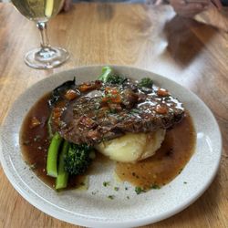 Huxleys - Beef Bourguignon, served on a bed of mash and tender stem broccoli