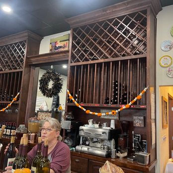 Balzano Vineyard - a woman sitting at a bar - Wine Tasting Room Near Me - Carlsbad, New Mexico Balzano Vineyard - a woman sitting at a bar - Wine Tasting Room Near Me - Carlsbad, New Mexico